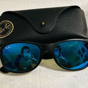 Ray-Ban Black Wayfarer Blue polarized lenses.